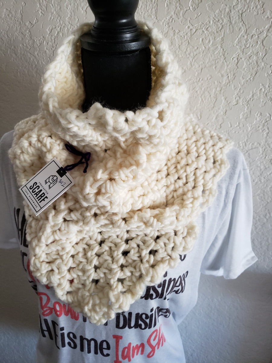 A white chunky triangle shell stitch scarf cowl displayed on a mannequin.
